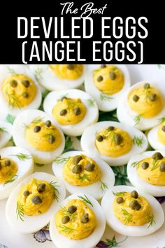 deviled eggs with olives on them and the words deviled eggs angel eggs