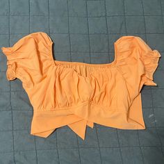 Peach Crop Top. Ties In A Bow In The Back. Runs Tts Orange Short Sleeve Crop Top For Summer, Summer Peach Cropped Tops, Spring Cotton Tops By Amazon, Orange Crop Top For Spring Day Out, Amazon Cotton Tops For Spring, Chic Orange Crop Top For Summer, Fitted Peach Crop Top For Summer, Chic Spring Tops From Amazon, Chic Amazon Tops For Spring