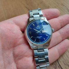 Vintage Orient Automatic Watch Specifications: - blue dial - mechanical Automatic winding - day and date calendar (have a button for quick date change) - stainless steel - 38 mm case in diameter - metal bracelet Each watch has been totally serviced by professional watchmaker and keep good time More WATCH: https://www.etsy.com/shop/MyVintageBAG Each Item will be very carefully protected , very carefully packed and shipped within 1-2 business days. If you have a question about this item, please contact me! PLEASE NOTE ♦ All our items are vintage and sold in their AS-IS condition! ♦ What you see in the photos is exactly what you get!  ♦ The real colors may slightly differ from their appearance on your display! PAYMENT POLICY: 1.) PayPal is accepted ---------- SHIPPING POLICY: 1.) Internationa Blue Analog Stainless Steel Watch Accessories, Blue Watch With Date Display As Gift, Vintage Blue Watch With Metal Dial, Blue Vintage Watch With Metal Dial, Groomsmen Watches, Wooden Watches For Men, Boys Watches, Personalized Watches, Watch Engraving