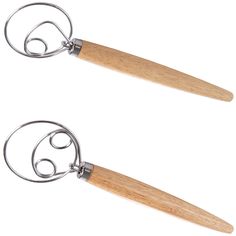 two metal and wood scissors on white background