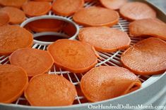 sliced carrots are being cooked on a grill