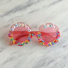 a pair of sunglasses with the words happy birthday written on them