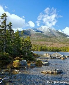 a mountain lake surrounded by trees and rocks