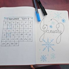 an open notebook with a calendar on the page and a pen sitting next to it