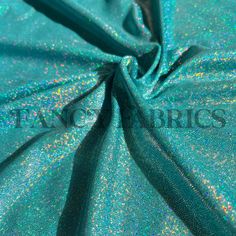 blue and green fabric with glitters on it