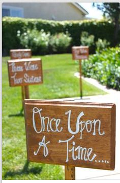 three wooden signs that say once upon a time