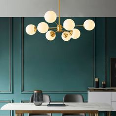 a dining room table with chairs and a chandelier hanging from it's ceiling