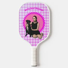 a paddle with a woman and her dog on it