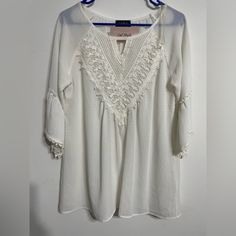 Beautiful White 3/4 Sleeves Woman Blouse , The V Neck Is In Lace Make The Piece Gorgeous . White 3/4 Sleeve Blouse For Vacation, White Half Sleeve Blouse For Spring, White 3/4 Sleeve Tops For Vacation, White Tops With 3/4 Sleeve And Lace Trim, Chic Half Sleeve Blouse For Vacation, Chic Half-sleeve Blouse For Vacation, Bohemian Blouse With 3/4 Sleeves For Daywear, Spring Half Sleeve Tops With Lace Trim, Casual Tops With Lace Trim And 3/4 Sleeve