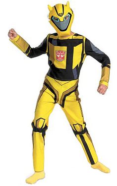 a man in a yellow and black costume is standing with his arms out to the side