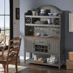 a dining room table with chairs and a china cabinet