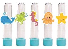 four different sea animals are on the top of three tubes with blue cups in them