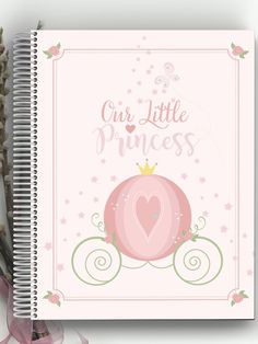 a spiral notebook with the words, our little princess on it and a pink carriage