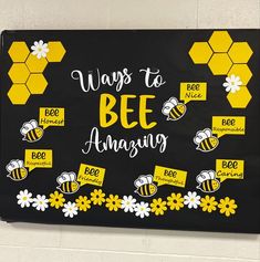 a black and yellow bulletin board with bees on it that says ways to bee amazing