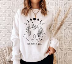 This Cute Moon & Tooth sweatshirt will be perfect for a dental hygienist! It would also make a great gift for the crew in the dental office or a dental student. - Gildan Brand - 50% cotton, 50% polyester, Medium-heavy fabric - Unisex Loose fit This is a UNISEX sweatshirt. Please carefully check the size chart in the images of this listing before ordering. We suggest you lay your favorite sweatshirt at home flat and measure to compare to the size chart. DESIGN / PRINTING - Please note that due to Future Dental Hygienist, Dental Content, Dental Hygiene Shirt, Dental Hygienist Graduation, Dental Ideas, Hygienist Gifts, Dental Shirt, Dental Hygiene Gifts, Dentist Hygienist