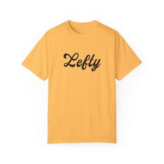 Get your Lefty Tee Today! Show the world you are part of the 10%. Comes in 3 fun colors! Citrus, Terracotta, and Bay. .: The Comfort Colors 1717 tee is made with medium fabric (6.1 oz/yd² (206.8 g/m consisting of high quality, 100% ring-spun US cotton for long-lasting comfort. .: The relaxed fit keeps the wearer comfy in both casual and semi-formal settings while the crew neckline delivers that classic, neat style which makes it perfect for accessorizing.  .: The pre-shrunk fabric ensures a consistently great fit. Check all available sizes in our Comfort Colors 1717 size chart.  .: All Comfort Colors 1717 shirts feature pre-shrunk cotton for size retention and a signature sewn-in twill label. .: Made using 100% US cotton that is ethically grown and harvested. Gildan is also a proud member Yellow Casual Tops With Funny Text, Yellow Casual Top With Funny Text, Casual Yellow Tops With Funny Text, Yellow Crew Neck Top With Funny Text, Yellow Crew Neck T-shirt With Funny Text, Yellow Graphic Tee With Funny Text, Saints Shirts, Japanese Dress, Neat Style