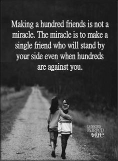 two people walking down a dirt road with the words making a hundred friends is not a miracle