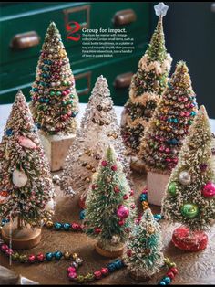 small christmas trees are sitting on a table