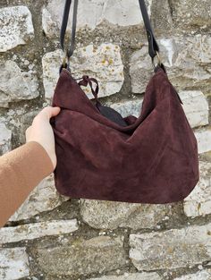 Features : - Aubergine colour suede, - Black hand dyed leather, - Zipped bag, - Unlined, - Inside cotton zipped pocket, Size: - Height 10.63 inch, - Lenght 14.96 inch, - Shoulder belt is adjustable. Handmade aubergine colour  suede  hobo bag  The bag is closed with a metallic zip.  Inside is unlined and there is a large cotton zipped pocket. There is a adjustable shoulder strap made with strong hand dyed leather. This medium size hobo bag is a perfect bag for every moment Contact me for any info Burgundy Hobo Bag With Zipper Closure, Everyday Burgundy Hobo Bag With Zipper Closure, Burgundy Hobo Bag With Zipper For Everyday Use, Purple Leather Shoulder Bag With Zipper Closure, Travel-ready Burgundy Hobo Bag With Zipper Closure, Purple Leather Hobo Tote Bag, Purple Leather Hobo Bag For Travel, Suede Hobo Travel Bag, Burgundy Hobo Bag With Zipper For Daily Use