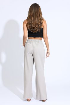 Step into effortless style and comfort with our Wide Leg Beach Pant in a chic taupe hue. These pants are designed for those who crave both relaxation and elegance, making them the perfect addition to your warm-weather wardrobe. Key Features: Fabric Contents: Crafted from a luxurious blend of 80% Rayon, 15% Linen, and 5% Cotton, these pants are soft to the touch and breathable, ensuring all-day comfort in the sun. Flattering Wide Leg Design: The wide leg silhouette offers a relaxed fit that flatt Skirt Crop, Tie Waist Pants, Beach Pants, Leg Design, Tops For Leggings, Cropped Jeans, Jogger Pants, Jeans Shop, Short Tops