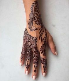 a henna tattoo on someone's hand