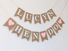 the bunting banner has hearts on it and says lucky's hendow