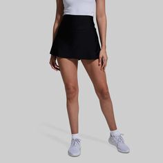 Ladies Tennis Golf Skirt | Born Primitive | Skirt with Built-In-Shorts Black Sports Skort With Built-in Shorts, Stretch Athleisure Bottoms For Golf, Athleisure Stretch Bottoms For Golf, Sporty Skort With Pockets For Sports, Functional Black Tennis Skirt With Built-in Shorts, Sporty Skort With Side Pockets, Black Fitted Functional Skort, Functional Black Fitted Skort, Tennis Bottoms With Built-in Shorts And 4-way Stretch