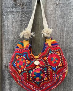 "Upcycled vintage Guatemalan \"Huipil\" textile ,with leather & antler trim & authentic Oaxacan tassel, makes for a colourful summer accessory, Full red satin lining with leather pocket." Bohemian Beach Bag With Leather Handles, Festival Hobo Bag With Leather Handles, Festival Hobo Shoulder Bag With Leather Handles, Festival Multicolor Woven Hobo Bag, Multicolor Woven Hobo Bag For Festivals, Festival Woven Hobo Shoulder Bag, Woven Hobo Bag For Festival, Artisan Multicolor Shoulder Bag For Summer, Traditional Multicolor Bag With Fringe