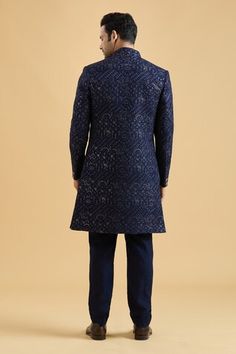 Navy blue sherwani featuring floral thread embroidery all over highlighted with sequin. Paired with a solid kurta and a pant. - Aza Fashions Fitted Unstitched Suit For Navratri Reception, Fitted Unstitched Suit For Reception And Navratri, Fitted Unstitched Suit For Reception During Navratri, Fitted Cutdana Churidar For Reception, Fitted Chikankari Embroidery Kurta For Reception, Blue Sherwani With Dori Work In Traditional Drape, Blue Sherwani With Dori Work, Blue Sherwani With Dori Work For Diwali, Blue Sherwani With Dori Work For Festivals