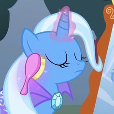 a blue pony with its eyes closed looking into a mirror