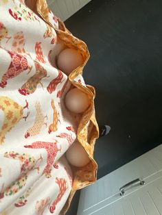 an egg is sitting in the middle of some fabric