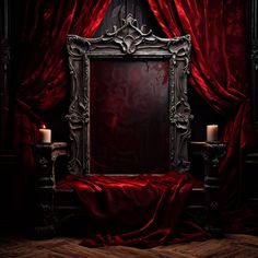 an ornate mirror in front of a red curtain with two candles on the floor next to it