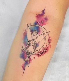 a small tattoo on the arm of a girl