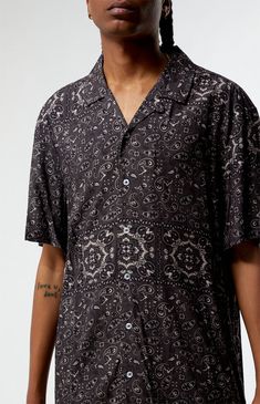 Infuse a polished charm into your daily look with the Paisley Camp Shirt from PacSun. Boasting a collared neckline, short sleeves, and standard fit, this shirt features button closures and a cool paisley print throughout, creating a stylish and refined addition to your casual wardrobe.


	Collared neckline
	Short sleeves
	Standard fit
	Button closures
	Paisley pattern throughout
	Model is wearing size large
	Model Measurements: 6'1” Height, 29.5" Waist, 32” Hips, 32” Inseam My Mobile Number, Camping Shirt, Paisley Pattern, Exclusive Collection, Daily Look, Pacsun, Paisley Print, Casual Wardrobe, Paisley