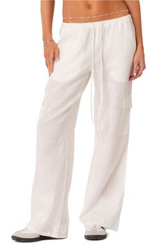 Travel back in time to the 2000s in cover-up cargo pants flaunting a low rise, full-length legs and plenty of pockets for utilitarian detail. 100% cotton Machine wash, line dry Imported Low Rise Cargo Pants, Cotton Cargo Pants, White Trousers, School Dresses, The 2000s, Cargo Pants Women, Swimsuit Cover Ups, Back In Time, Military Fashion