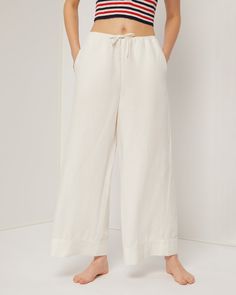 White Wide-leg Lounge Pants With Drawstring, Chic Ankle-length Lounging Bottoms, Relaxed Fit Wide Leg Pants With Drawstring, Solid Color Wide Leg Pants For Spring Lounging, Relaxed Wide Leg Pants For Spring Lounging, Chic Straight Leg Bottoms With Drawstring, Lounging Pants With Drawstring And Straight Cut, Ankle-length Tie Waist Pants, Linen Wide Leg Bottoms With Drawstring