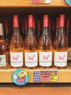 several bottles of wine on display in a store