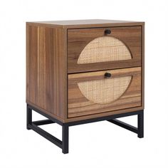 the side table has two drawers with rattan handles and an oval design on each drawer