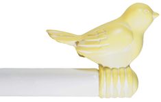 a yellow bird figurine sitting on top of a roll of white toilet paper