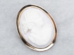 Add a touch of vintage charm to any outfit with this brooch! Featuring a gorgeous cameo design in a simple, elegant frame, this brooch is the perfect accessory for any occasion. Made with yellow gold, it's as timeless as it is stylish. Love this piece but want to make it more versatile? We here at Market Square Jewelers along with our master metalsmiths can convert this fantastic brooch into a necklace or pendant for an additional fee, please get in touch with us for more information! Metal: 10K Simple Frame, Market Square, Cameo Jewelry, Elegant Frame, Vintage Cameo, Cameo Brooch, Vintage Brooch, Simple Elegant, Jewelry Vintage