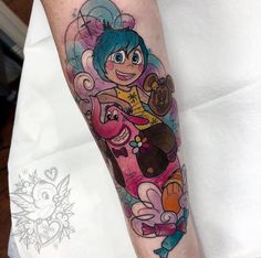 a cartoon character tattoo on the arm