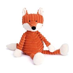 an orange stuffed animal sitting on top of a white floor