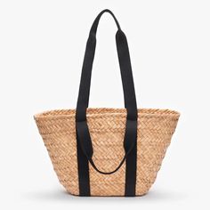 The Selma tote can be carried by its top handles or on your shoulder. It's the ultimate warm weather staple. Handcrafted from all-natural woven seagrass straw using a time-honored Filipino basketweaving technique. Features dual cotton handles. Measures 17.5" W by 9.5" H by 5.5"D with a 6" and 12" handle drop. Made in the Philippines FINAL SALE Belly Bag, Straw Clutch, Quilted Duvet Cover, Boot Jewelry, Winter Sneakers, Toddler Boy Shoes, Straw Tote, St Tropez, Women Men Shoes