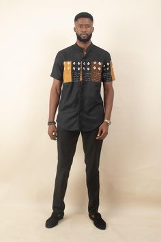 Elevate your wardrobe with the Ekosa African Print Men's Shirt, a sophisticated blend of traditional African motifs and contemporary style. This short sleeve shirt features a striking brown and black Ankara print across the chest and sleeves, making it a standout piece for any occasion. Handmade in Nigeria, the Ekosa shirt is designed with both style and comfort in mind, offering a modern fit that's perfect for both casual and semi-formal settings. Features: Handmade in Nigeria Short Sleeve with Traditional Black Cotton Shirt, Traditional Black Shirt For Summer, Ankara Design, African Motifs, African Print Shirt, Ankara Tops, Ankara Designs, Ankara Print, Cultural Celebration