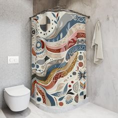 a bathroom with a shower curtain that has an abstract design on it and a toilet next to it