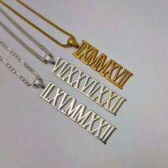 "Personalized Roman Numeral Necklace, Custom Roman Numeral Charm, Womens Gifts, Christmas Gift For Her, Anniversary Gifts, Handmade Jewelry P E R S O N A L I Z E D ∙ J E W E L R Y ❤ Handmade with love ❤ 🧿 Welcome to GDjeweltr. All our jewelery is made by handmade in our workshop as custom. The most unique gift you can find for you and your loved ones ♥ Please take a look my store to see our handmade necklaces, rings, earrings and bracelets collection. ⭐ Item Details: * Material: High Quality Solid 925 Sterling Silver * Finish: Silver, Gold, Rose. * Pendant height : 9 mm * Box (60) Chain : 1.30 mm * Curb (60) Chain : 2.15 mm * Figaro (60) Chain : 2.10 mm ✅ Making Process : All of our jewelry are handmade, carefully handcrafted and made to order. All of our products are produced by hand wor Silver Jewelry For New Year Gift, Silver Necklace For Christmas Celebration, Customizable Silver Jewelry For Christmas, Customized Silver Jewelry For Christmas, Personalized White Jewelry For Celebration, Handmade Jewelry For Birthday And Christmas, Handmade Jewelry For Christmas And Birthday, Silver Necklaces For Valentine's Day Celebration, Customized Necklaces For Anniversary