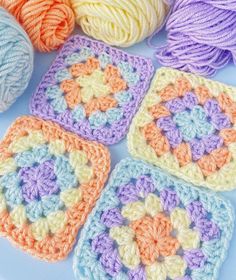 crocheted squares are arranged on a table