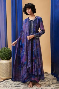 Blue flat chiffon kurta with abstract print and sequins embroidery. Comes with pant and a dupatta.
Components: 3
Pattern: Printed, Embroidered
Type Of Work: Abstract, Sequins
Neckline: Round
Sleeve Type: Full
Fabric: Flat chiffon
Color: Blue
Other Details: 
Attached lining
Approx Product Weight: 1 Kg
Occasion: Sangeet - Aza Fashions Blue Silk Salwar Kameez With Long Sleeves, Blue Georgette Dupatta With Printed Motifs, Blue Georgette Long Sleeve Sets, Blue Georgette Maxi Length Set, Blue Long Sleeve Georgette Sets, Blue Bohemian Salwar Kameez With Traditional Drape, Blue Bohemian Style Designer Wear Dupatta, Blue Bohemian Designer Wear Dupatta, Transitional Blue Georgette Kurta