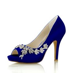 a pair of blue high heeled shoes with flowers on the toe and an embellishment