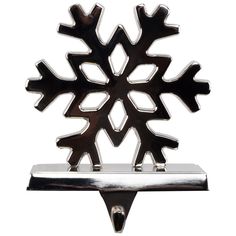 a metal snowflake on top of a shelf